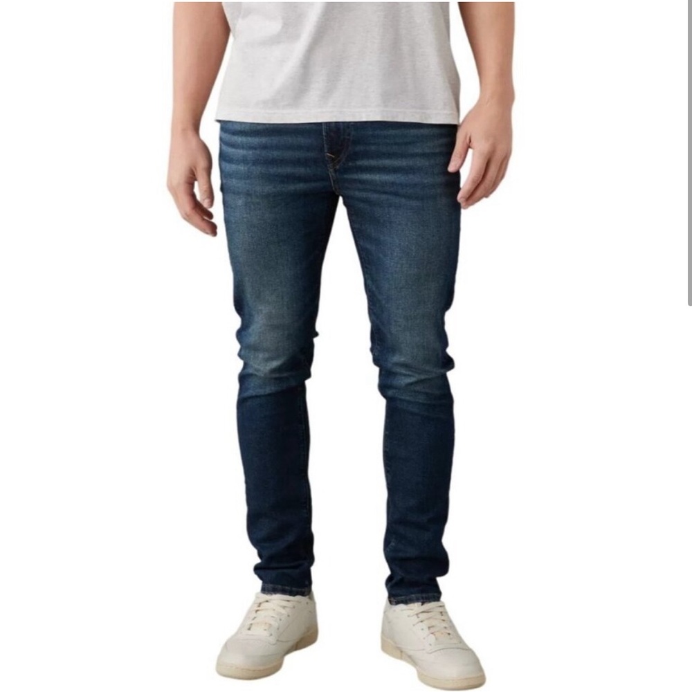 American Eagle Medium Distressed Denim Airflex
Stretch Athletic Straight Jeans
